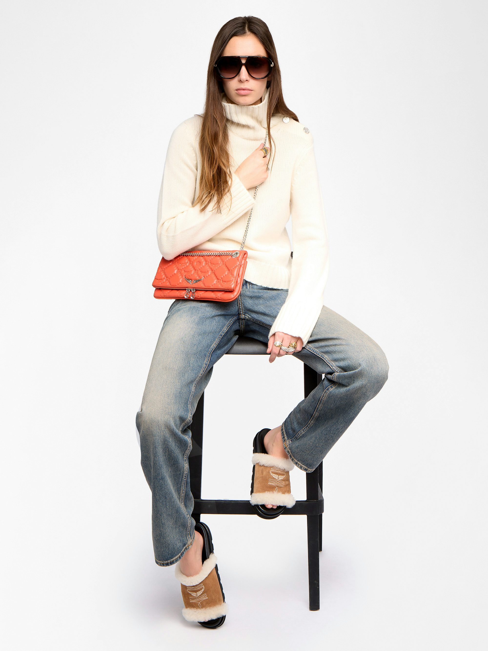 Rock II Quilted Monogram Clutch - Clutch in smooth quilted leather with sliding metal chain and signature wings.